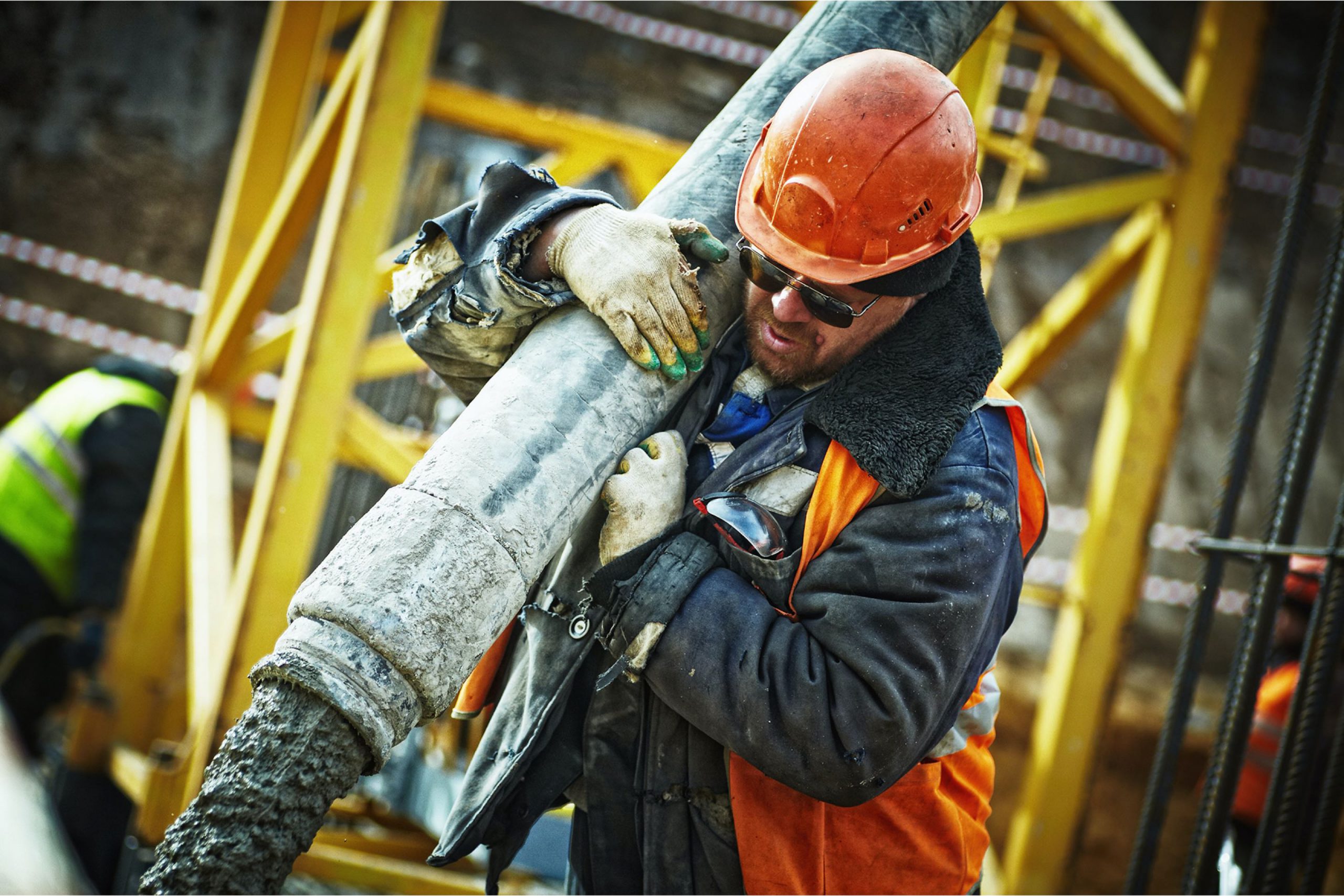 man pouring concrete - concrete calculator concept