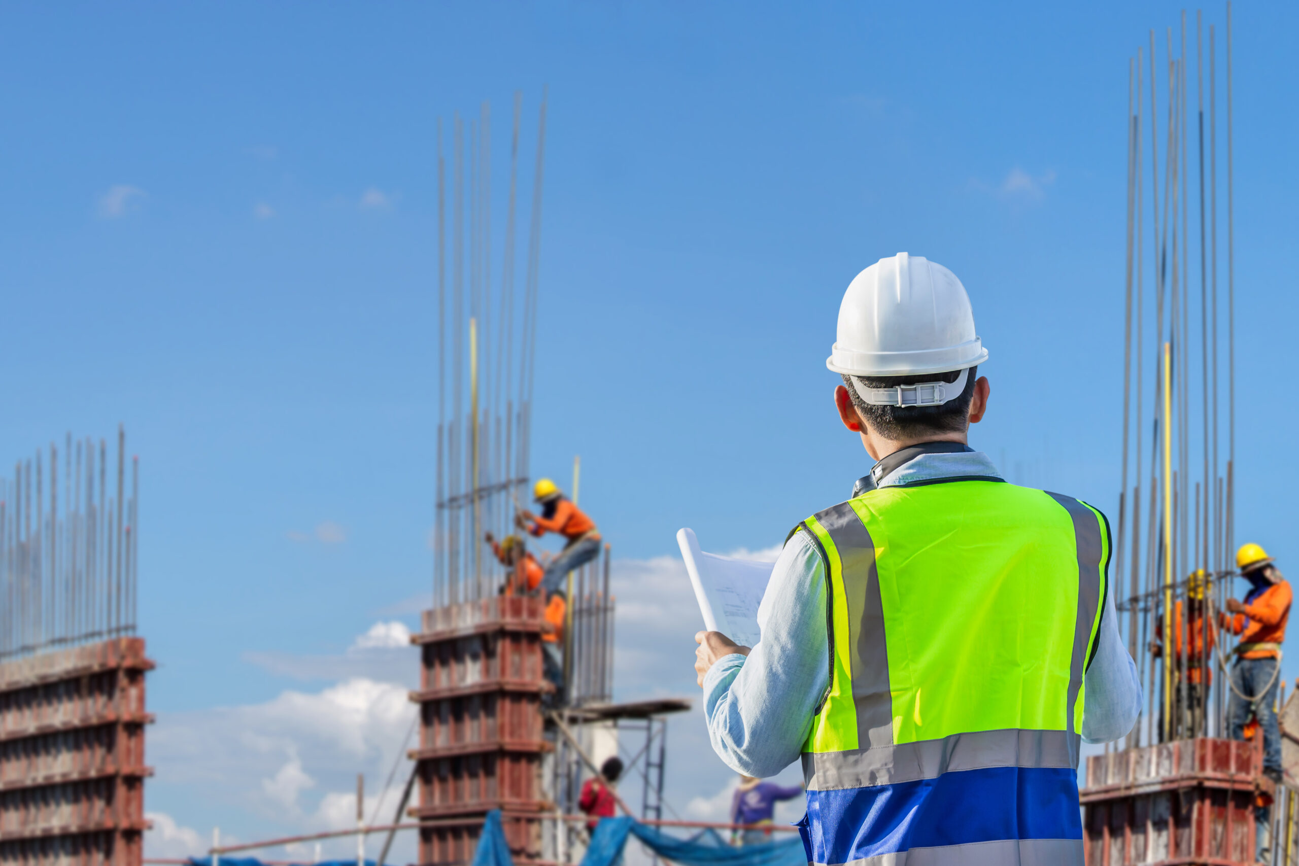 construction worker looking over worksite