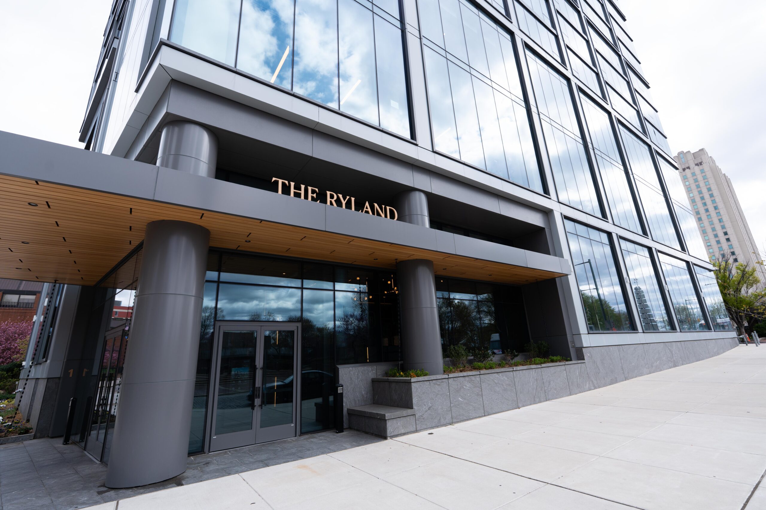 A picture of the front entrance of The Ryland, a residential high-rise building in Philadelphia, PA.